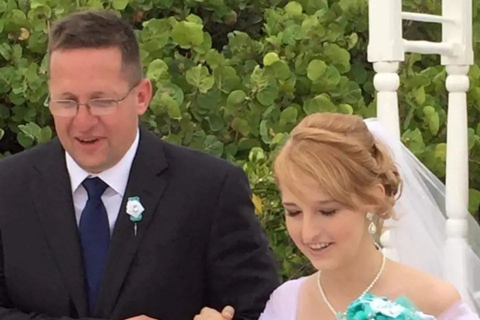 A bride and groom during their outdoor wedding ceremony