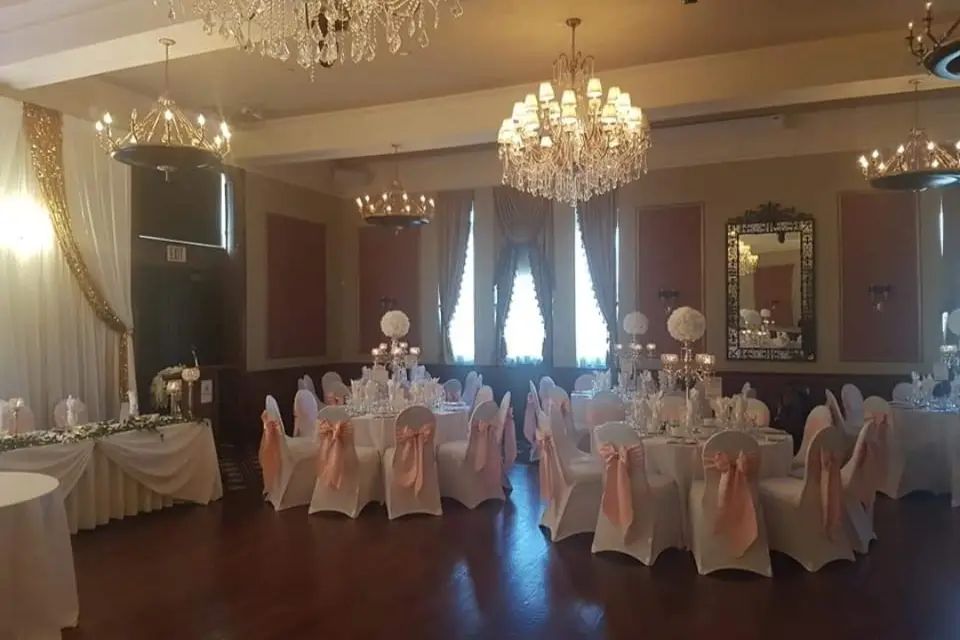 A reception hall set for dinner, ready before guests arrive